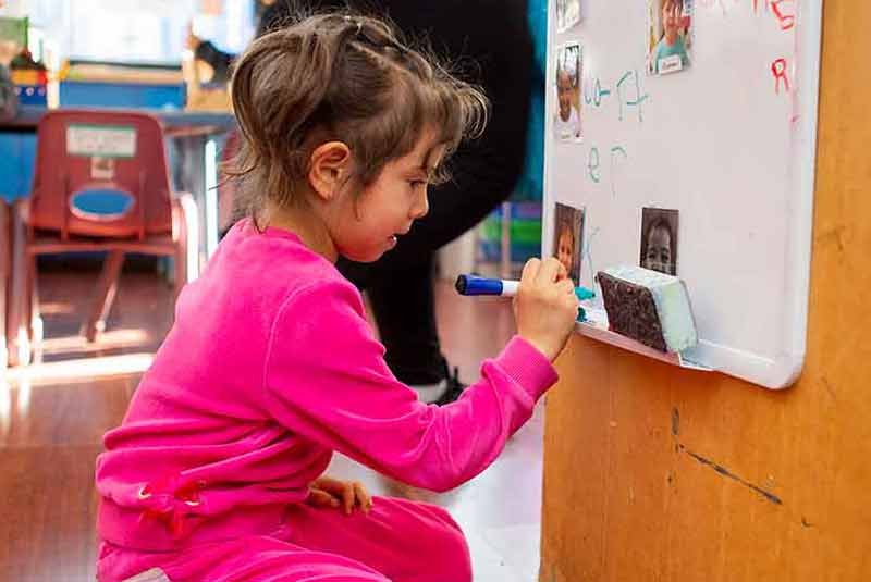 Girl signing her name